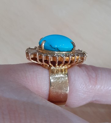 Lot 2005 - A Turquoise and Diamond Cluster Ring the oval...