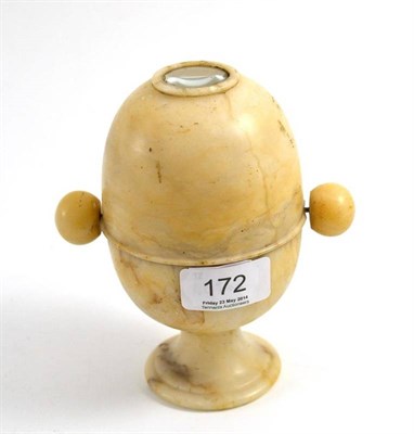 Lot 172 - A large Victorian alabaster peep viewer or peep egg, the domed body housing a revolving...
