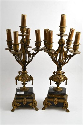 Lot 173 - A pair of French five branch gilt metal lamps on marble bases