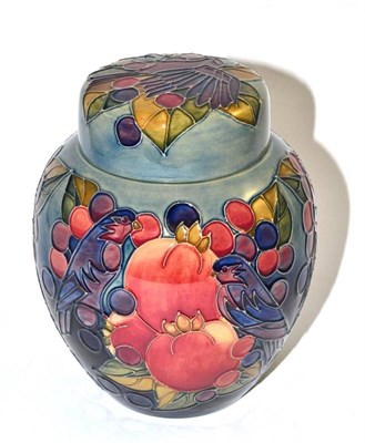 Lot 198 - A modern Moorcroft Finches ginger jar and cover, on a blue ground