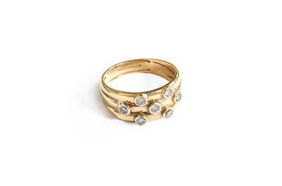 Lot 291 - A 9 Carat Gold Diamond Triple Row Ring, the...