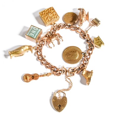 Lot 334 - A Charm Bracelet, stamped '9' and '.375', hung...