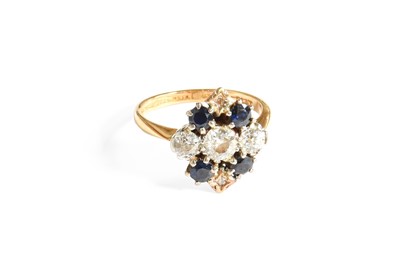 Lot 335 - A Sapphire and Diamond Cluster Ring, stamped...