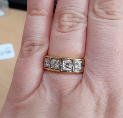 Lot 2167 - A Diamond Four Stone Ring the round brilliant...