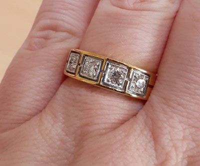 Lot 2167 - A Diamond Four Stone Ring the round brilliant...