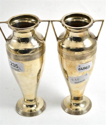 Lot 235 - A pair of silver twin handled vases, Chester 1923