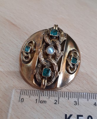 Lot 2047 - An Emerald and Split Pearl Brooch the circular...