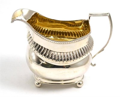 Lot 237 - A George III silver cream jug