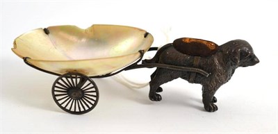 Lot 244 - A silver pin cushion modelled as a dog fitted with a later white metal and mother-of-pearl...
