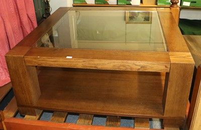 Lot 1148 - A Modern Oak Coffee Table with glass top and...