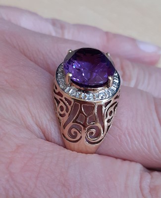 Lot 2180 - An Amethyst and Diamond Cluster Ring the oval...