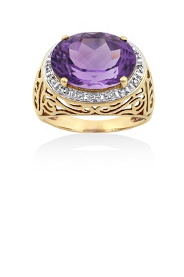 Lot 2180 - An Amethyst and Diamond Cluster Ring the oval...