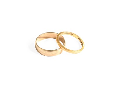 Lot 308 - A 22 Carat Gold Band Ring, finger size K; and...