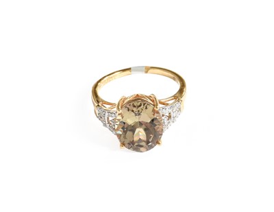 Lot 304 - An 18 Carat Gold Csarite and Diamond Ring,...