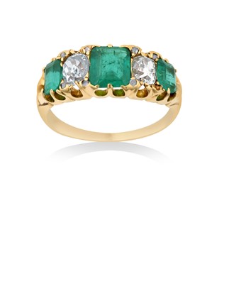 Lot 2273 - An Emerald and Diamond Five Stone Ring three...