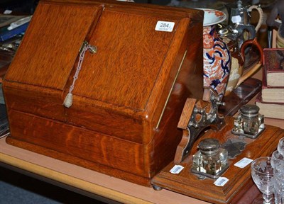 Lot 284 - An oak correspondence box and an oak ink stand (2)
