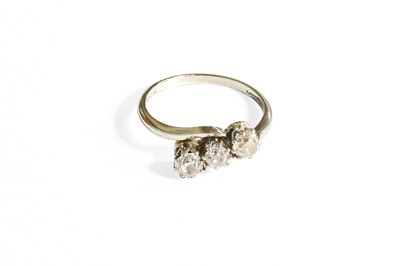 Lot 375 - A Diamond Three Stone Twist Ring, the old cut...