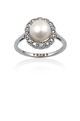 Lot 2041 - A Pearl and Diamond Cluster Ring the button...