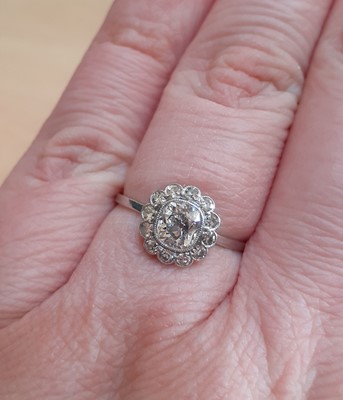 Lot 2038 - A Diamond Cluster Ring the old cut diamond...