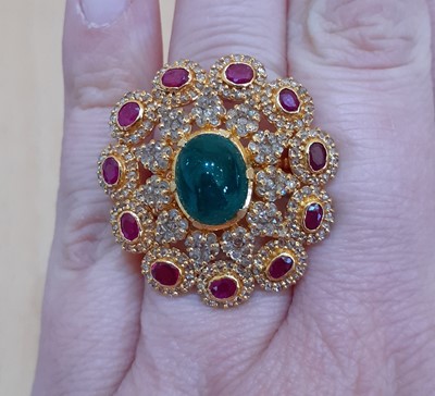 Lot 2119 - A Diamond, Ruby and Emerald Cluster Ring the...