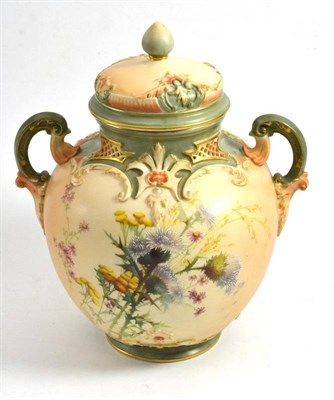 Lot 301 - A Royal Worcester blush ivory vase and cover, shape 1515, painted with thistles