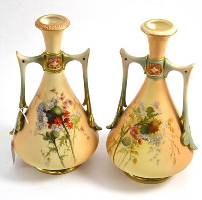 Lot 302 - A pair of Royal Worcester blush ivory vases, shape 1021, painted with thistles