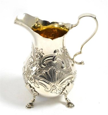 Lot 306 - An Edward VII silver cream jug in the George III style, London 1908