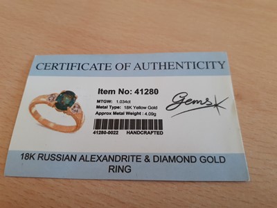 Lot 2028 - An 18 Carat Gold Alexandrite and Diamond Ring...