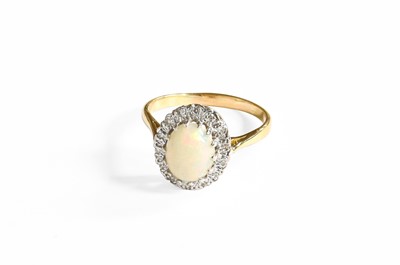 Lot 325 - An Opal and Diamond Cluster Ring, stamped...