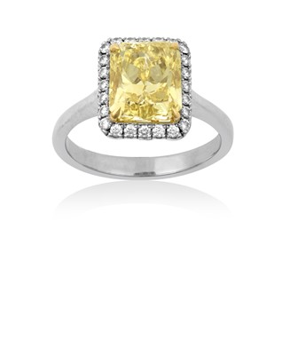 Lot 2312 - A Diamond Cluster Ring the fancy intense...