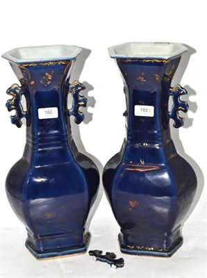 Lot 182 - A Pair of Chinese Porcelain Hexagonal Baluster Vases, 18th century, with stylised mythical...