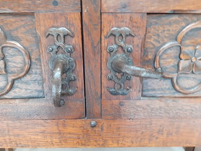 Lot 272 - An Arts & Crafts Carved Oak Cupboard, the...