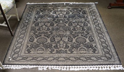 Lot 1201 - An Unusual Signed Cotton Rug, the indigo field...