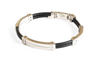 Lot 405 - A Contemporary Bracelet, four double row black...