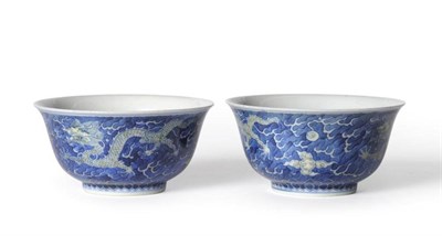 Lot 183 - A Pair of Chinese Porcelain Bowls, Kangxi mark and possibly of the period, painted in yellow...