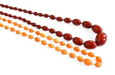 Lot 406 - A Graduated Amber Bead Necklace, length 112cm;...