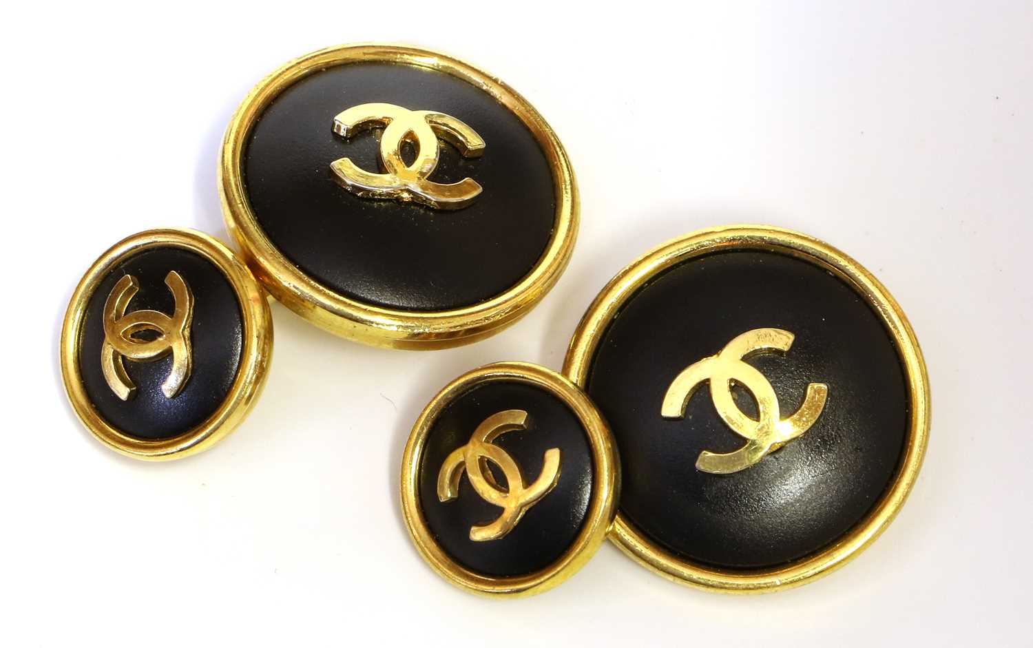 Lot 2119 - A Pair of Chanel Cufflinks, the circular matte...