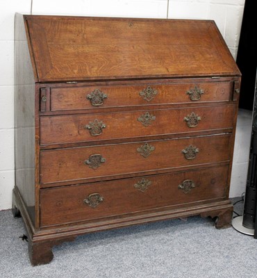 Lot 1422 - A George III Crossbanded Oak Bureau, with...