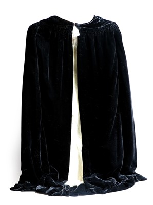 Lot 146 - Black Velvet and Ermine Lined Cape, retailers...