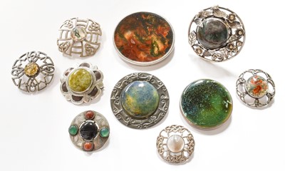 Lot 427 - Nine Silver/White Metal Brooches and a Ring,...