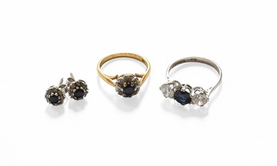 Lot 419 - An 18 Carat Gold Sapphire and Diamond Cluster...