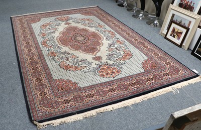 Lot 1212 - A Machine Made Rug, the ivory field of...