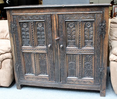 Lot 1454 - A Carved Oak Cupboard, 18th century and later,...