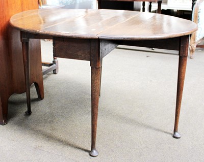 Lot 1358 - An 18th Century Oak Drop Leaf Table, on pad...