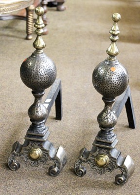 Lot 1394 - A Pair of Brass and Patinated And Irons