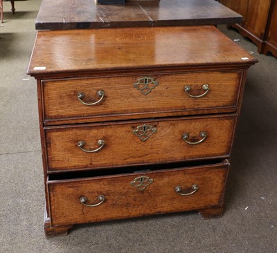 Lot 1396 - A George III Oak Three Height Chest of Drawers...