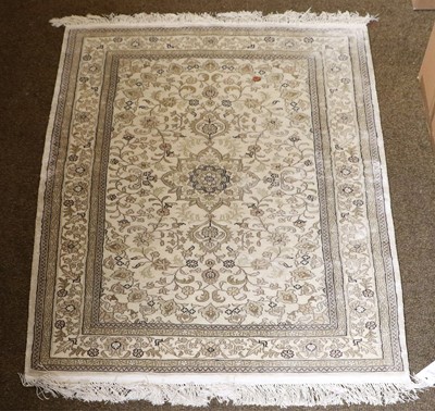 Lot 1202 - A Modern Indian Rug, the cream field with...