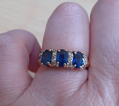 Lot 2149 - A Sapphire and Diamond Ring the three oval cut...