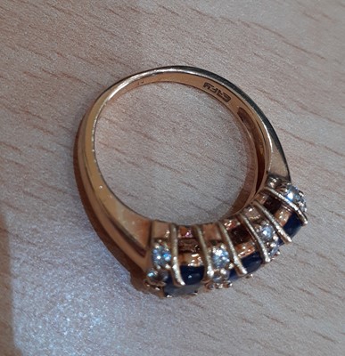 Lot 2149 - A Sapphire and Diamond Ring the three oval cut...
