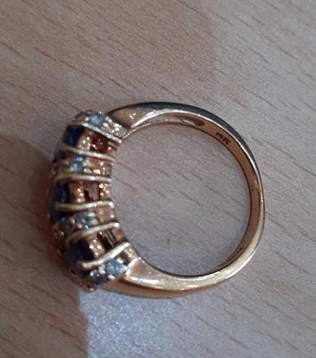 Lot 2149 - A Sapphire and Diamond Ring the three oval cut...